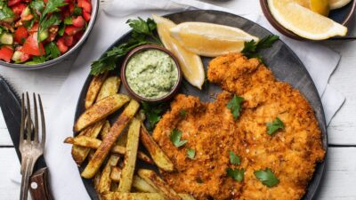 Crispy Schnitzel with Israeli Salad and Oven Fries