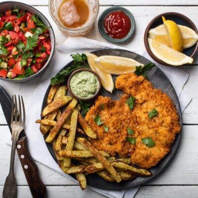 Crispy Schnitzel with Israeli Salad and Oven Fries