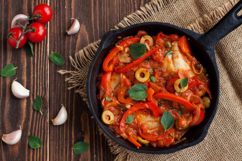 white fish with peppers and onions